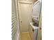 This laundry room features a stacked washer and dryer at 805 N Clake St, Deland, FL 32724