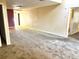 Large living area with neutral-toned carpet and walls, providing a blank canvas at 805 N Clake St, Deland, FL 32724