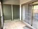 Outdoor patio with sliding glass doors to the inside and multiple storage closets at 805 N Clake St, Deland, FL 32724