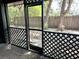 Screened-in porch area provides an outdoor living space with views of the yard at 805 N Clake St, Deland, FL 32724