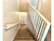 Carpeted staircase with white railing leading to the upper level of the home at 805 N Clake St, Deland, FL 32724