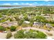 An aerial view of the property nestled in a lush, green neighborhood with a view of the bay and city at 88 Valencia Dr, Ormond Beach, FL 32176
