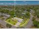 An aerial view shows the property located in a lush, green neighborhood with proximity to the coast at 88 Valencia Dr, Ormond Beach, FL 32176