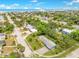 Scenic aerial view displays the property nestled within a lush, tree-filled neighborhood with views of the coast at 88 Valencia Dr, Ormond Beach, FL 32176