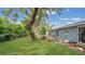 Expansive backyard featuring a fire pit and ample space for relaxation and outdoor activities at 88 Valencia Dr, Ormond Beach, FL 32176