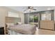 Bedroom featuring backyard access through sliding glass door and a neutral color palette at 88 Valencia Dr, Ormond Beach, FL 32176