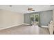 Spacious bedroom with sliding glass doors leading to outdoor space and modern flooring at 88 Valencia Dr, Ormond Beach, FL 32176