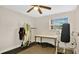 Bedroom setup with surfboards hanging on the wall, a desk, and workout equipment at 88 Valencia Dr, Ormond Beach, FL 32176