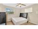 Bright bedroom featuring a stylish black headboard and two windows offering natural light at 88 Valencia Dr, Ormond Beach, FL 32176