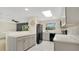 Modern kitchen with gray cabinets, stainless steel appliances, and a skylight for natural light at 88 Valencia Dr, Ormond Beach, FL 32176