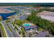 Aerial view of home in relation to the community pool and ponds at 887 Lake Hill Way, Deland, FL 32724