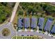 Aerial view of a neighborhood highlighting the property, surrounding houses, and landscaping in an established community at 887 Lake Hill Way, Deland, FL 32724
