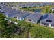 Aerial view of home's backyard featuring a covered patio and green grass at 887 Lake Hill Way, Deland, FL 32724