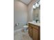 A well-lit powder bathroom with a modern vanity and toilet shows neutral paint and a clean design at 887 Lake Hill Way, Deland, FL 32724