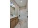 Bathroom featuring a vanity and a shower-tub combo with glass screen at 887 Lake Hill Way, Deland, FL 32724