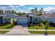 A charming single-Gathering home with a well-kept lawn, landscaped front yard, and a paved driveway at 887 Lake Hill Way, Deland, FL 32724