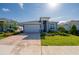 Beautiful single-story home with a brick paver driveway and well-maintained landscaping at 887 Lake Hill Way, Deland, FL 32724