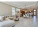 Bright living room showcasing a comfortable sectional sofa and an open layout to the kitchen at 887 Lake Hill Way, Deland, FL 32724