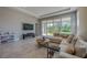 Spacious living room with a comfortable sectional sofa and large glass sliding doors at 887 Lake Hill Way, Deland, FL 32724