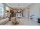 Open-concept living room with a cozy sofa, modern decor, and seamless flow to the dining area at 887 Lake Hill Way, Deland, FL 32724