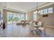 Spacious living area with access to the backyard, dining area, and plenty of natural light at 887 Lake Hill Way, Deland, FL 32724
