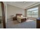 Sunlit main bedroom features a large window and wood furniture at 887 Lake Hill Way, Deland, FL 32724