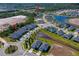 Aerial view of neighborhood and clubhouse featuring ponds and attractive landscaping at 887 Lake Hill Way, Deland, FL 32724