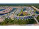 An aerial view of homes in the neighborhood, showcasing water views and landscaping at 887 Lake Hill Way, Deland, FL 32724