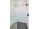 Modern shower with frameless glass enclosure, sleek tile design, and matte black fixtures at 887 Lake Hill Way, Deland, FL 32724