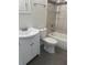 Bathroom with a white sink and vanity and a toilet next to a tub at 926 Clover St, Deland, FL 32720
