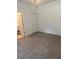 Cozy bedroom featuring neutral carpet and a closet space perfect for relaxing at 926 Clover St, Deland, FL 32720
