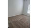 Neutral bedroom featuring carpet floors and natural light at 926 Clover St, Deland, FL 32720