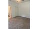 Comfortable bedroom features neutral carpet and a closet for storage at 926 Clover St, Deland, FL 32720