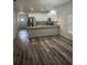 Open-concept dining and kitchen area with stainless steel appliances and modern countertops at 926 Clover St, Deland, FL 32720