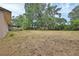 Large backyard with privacy fence, mature trees, and plenty of space to enjoy outdoor living at 1075 Burgoyne Rd, Deland, FL 32720