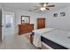 Bright bedroom with ceiling fan, wood dresser and tiled floor at 1075 Burgoyne Rd, Deland, FL 32720