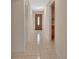 Entry hallway features front door and access to kitchen and closet at 1075 Burgoyne Rd, Deland, FL 32720