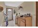 Well-lit laundry room with washer, dryer, and storage cabinets at 1075 Burgoyne Rd, Deland, FL 32720