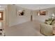 Open-concept living room with tile flooring, plenty of natural light, and view into other rooms at 1075 Burgoyne Rd, Deland, FL 32720