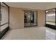 Screened in patio with tile floor leading to a sliding glass door and views of the backyard at 1075 Burgoyne Rd, Deland, FL 32720