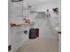 Walk-in closet with built-in shelving and tile flooring at 1075 Burgoyne Rd, Deland, FL 32720