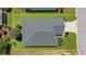 Birds-eye view of home showcasing the well-manicured lawn and neatly arranged landscaping around the property at 11094 Se 173Rd Ln, Summerfield, FL 34491