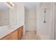 A spacious bathroom featuring neutral tones, marble vanity, and tile floor at 11094 Se 173Rd Ln, Summerfield, FL 34491