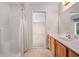 Bathroom boasts a marble vanity, tile floor, and shower at 11094 Se 173Rd Ln, Summerfield, FL 34491