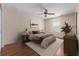Bright bedroom featuring a ceiling fan, and wood floors at 11094 Se 173Rd Ln, Summerfield, FL 34491