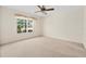 An empty bedroom with a large window allowing in plenty of natural light at 11094 Se 173Rd Ln, Summerfield, FL 34491