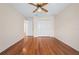Bright bedroom with hardwood floors, ceiling fan, and closet at 11094 Se 173Rd Ln, Summerfield, FL 34491
