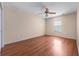 An expansive bedroom with neutral walls and hardwood floor, illuminated by natural light at 11094 Se 173Rd Ln, Summerfield, FL 34491