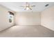 An expansive bedroom with neutral walls and carpet, illuminated by natural light at 11094 Se 173Rd Ln, Summerfield, FL 34491