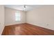 Neutral bedroom features a ceiling fan and window at 11094 Se 173Rd Ln, Summerfield, FL 34491